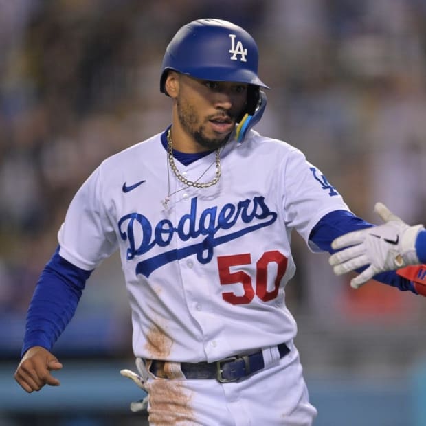 Jun 3, 2022; Los Angeles, California, USA; Los Angeles Dodgers right fielder Mookie Betts (50) celebrates after scoring on a RBI single by shortstop Trea Turner (not pictured) in the seventh inning against the New York Mets at Dodger Stadium. Mandatory Credit: Jayne Kamin-Oncea-USA TODAY Sports