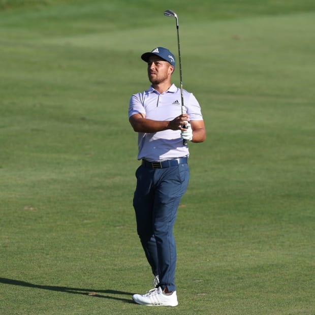 Jun 26, 2022; Cromwell, Connecticut, USA; Xander Schauffele plays a shot from the fairway of the 18th hole during the final round of the Travelers Championship golf tournament. Mandatory Credit: Vincent Carchietta-USA TODAY Sports