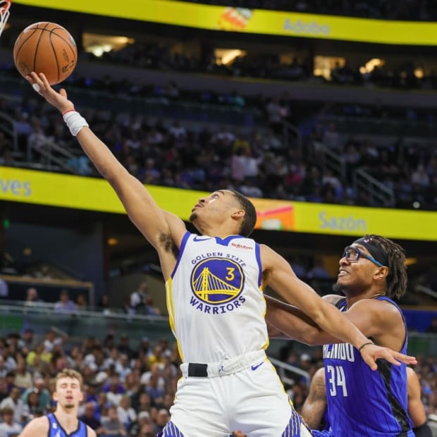 Nov 3, 2022; Orlando, Florida, USA; Golden State Warriors guard Jordan Poole (3) goes to the basket in front of Orlando Magic center Wendell Carter Jr. (34) during the second quarter at Amway Center. Mandatory Credit: Mike Watters-USA TODAY Sports