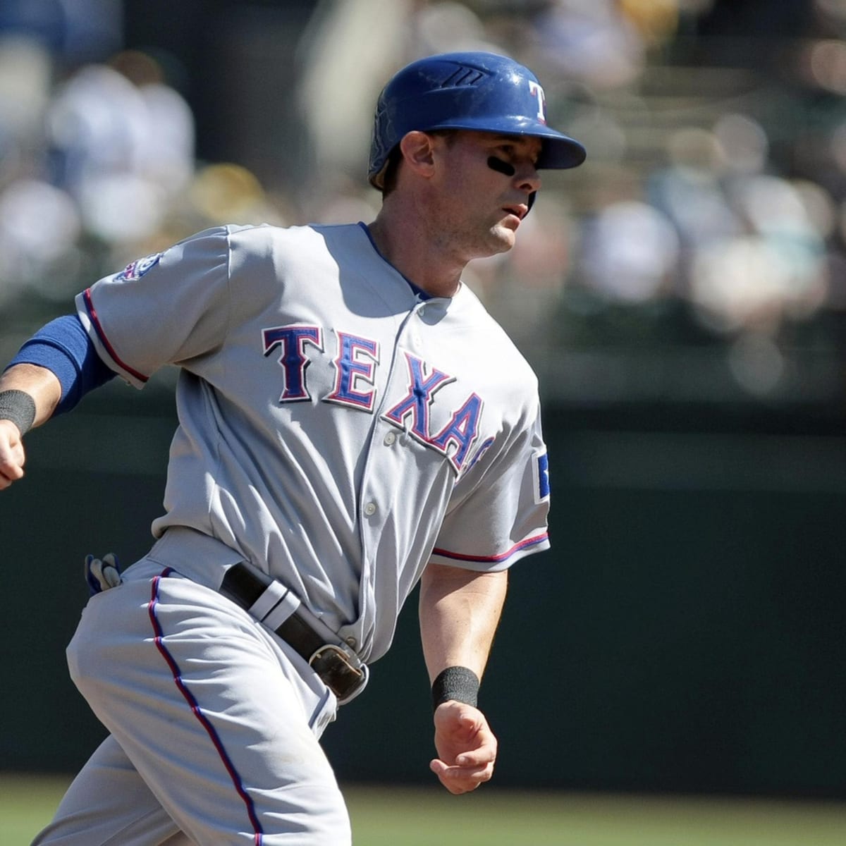 Texas Rangers' Michael Young, right, reaches up to congratulate