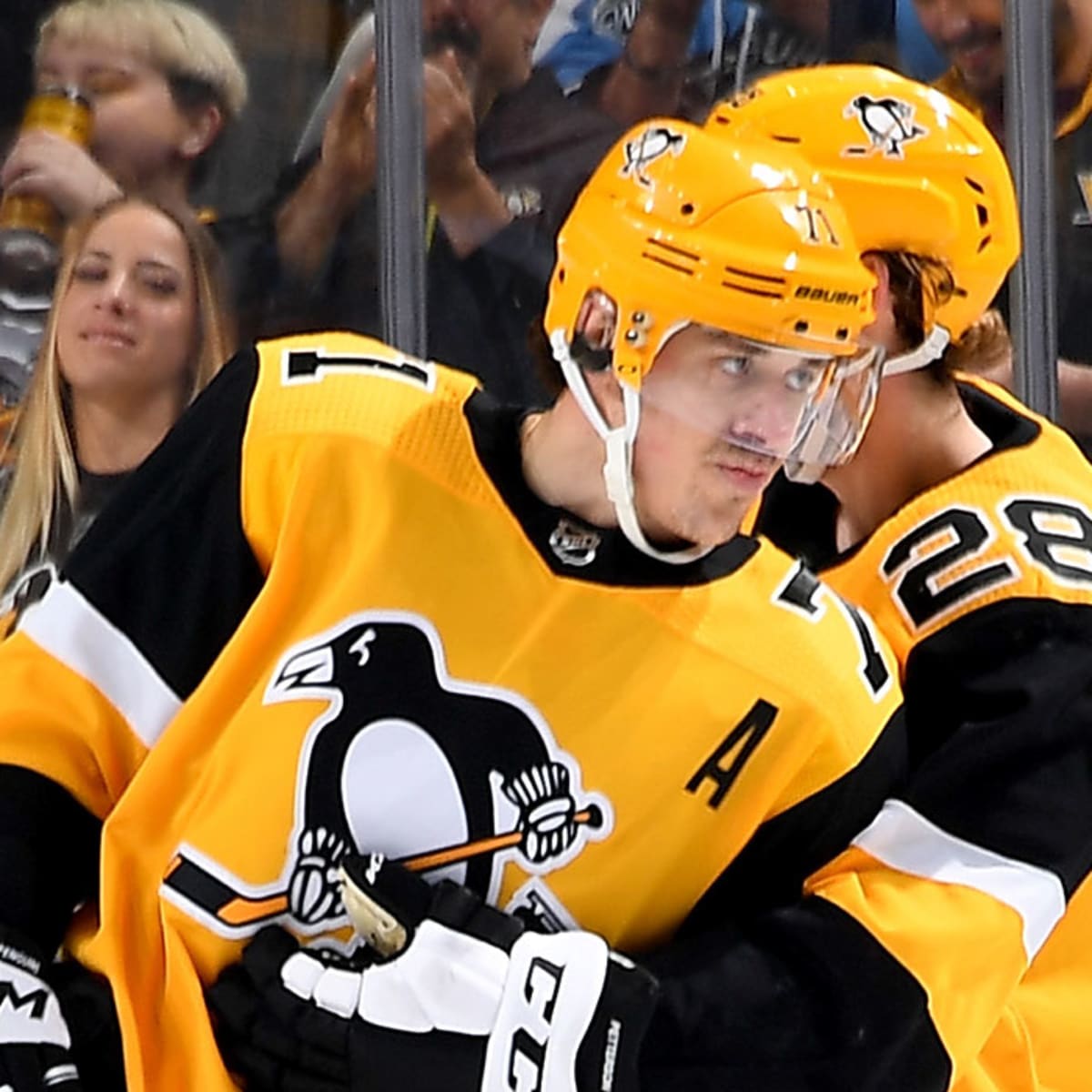 NHL great Mario Lemieux talks to Evgeni Malkin of the Pittsburgh News  Photo - Getty Images
