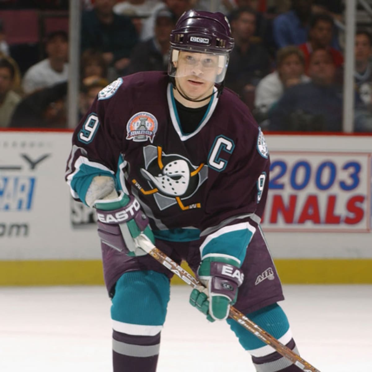 NHL99: Paul Kariya, dog on his chest, feet in water, is content