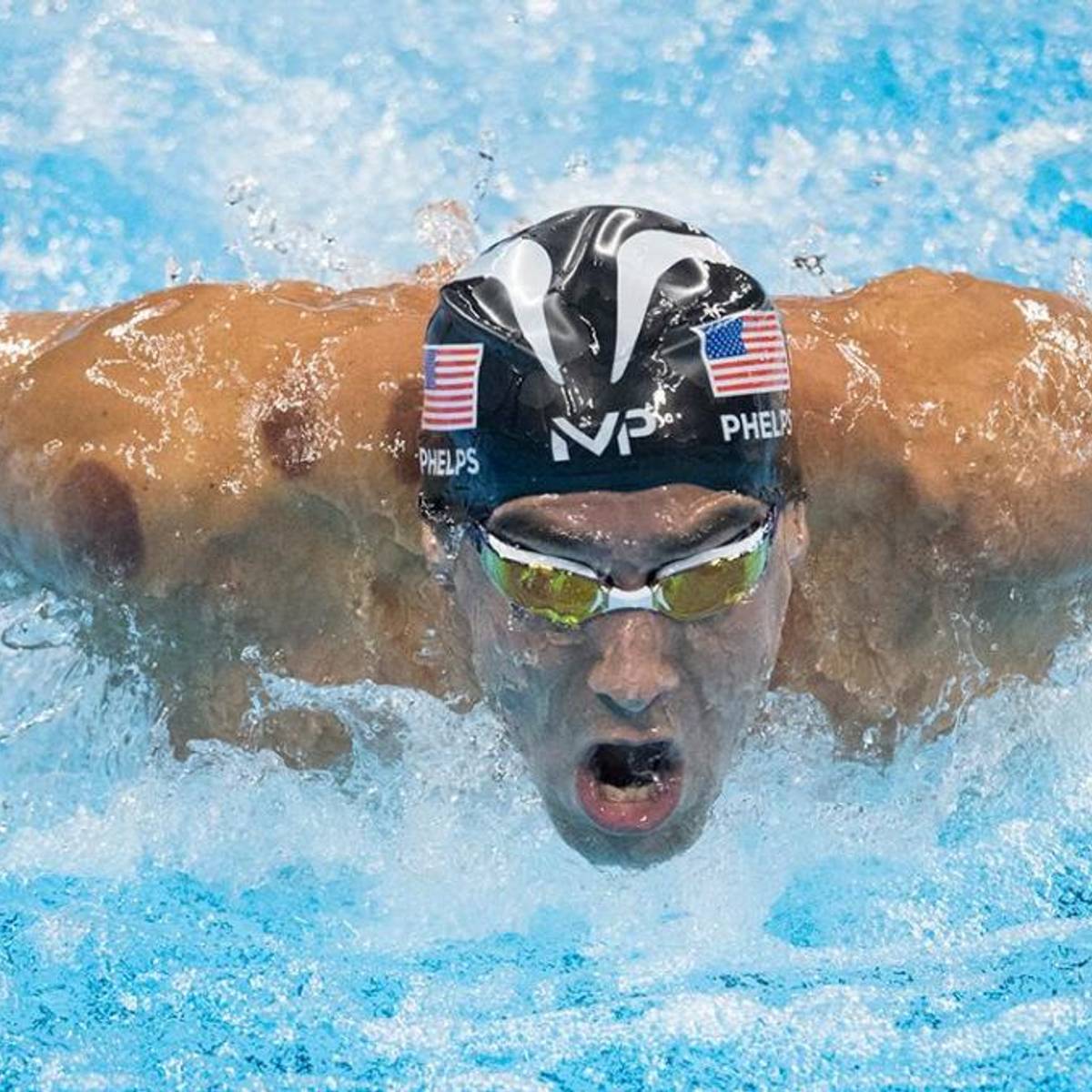 Michael Phelps rips swimming cap before 
