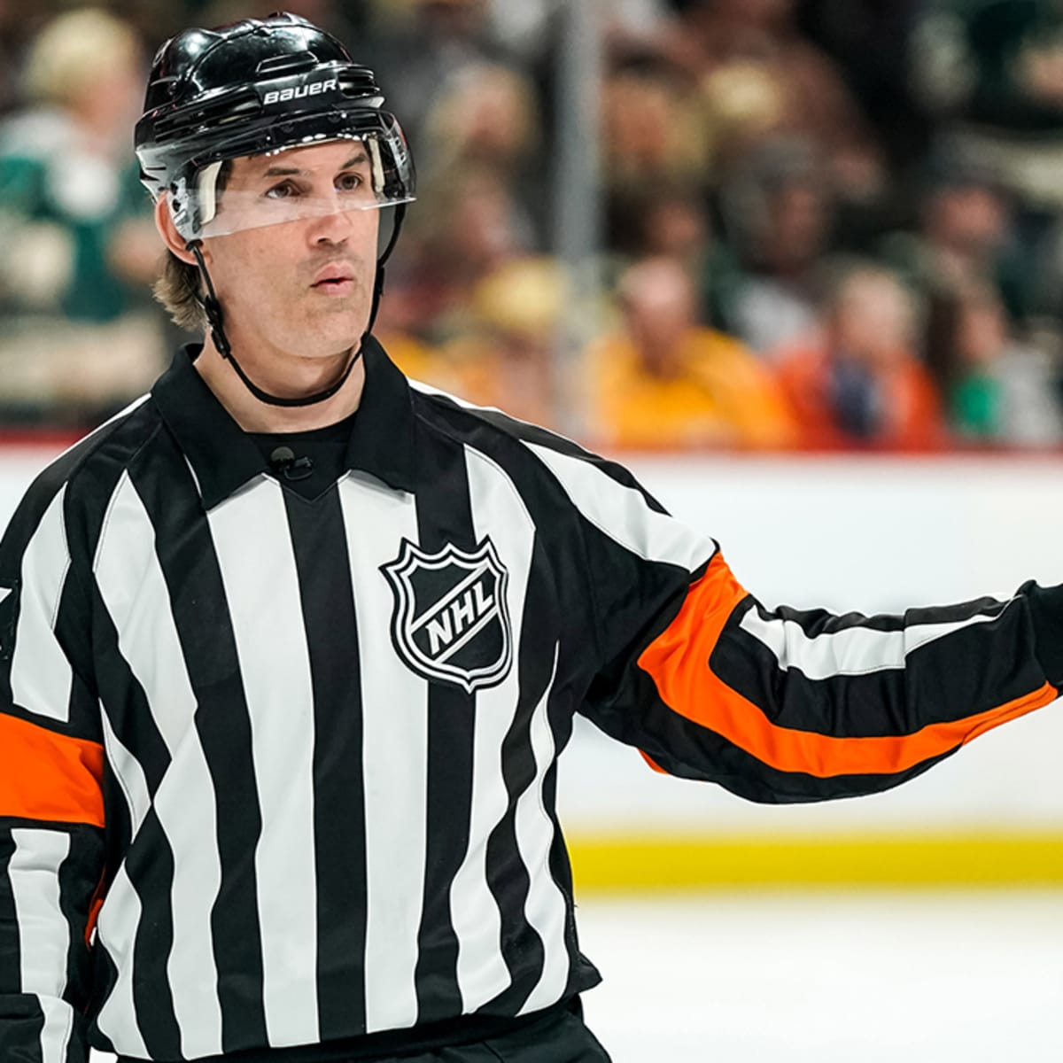 NHL referee Wes McCauley skates with the name Mick on his jersey