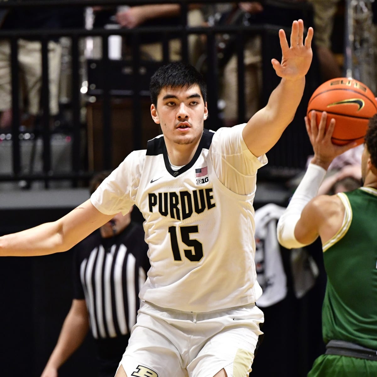 Purdue's Jaden Ivey drives hard to the basket and finishes a tomahawk dunk  on Indiana
