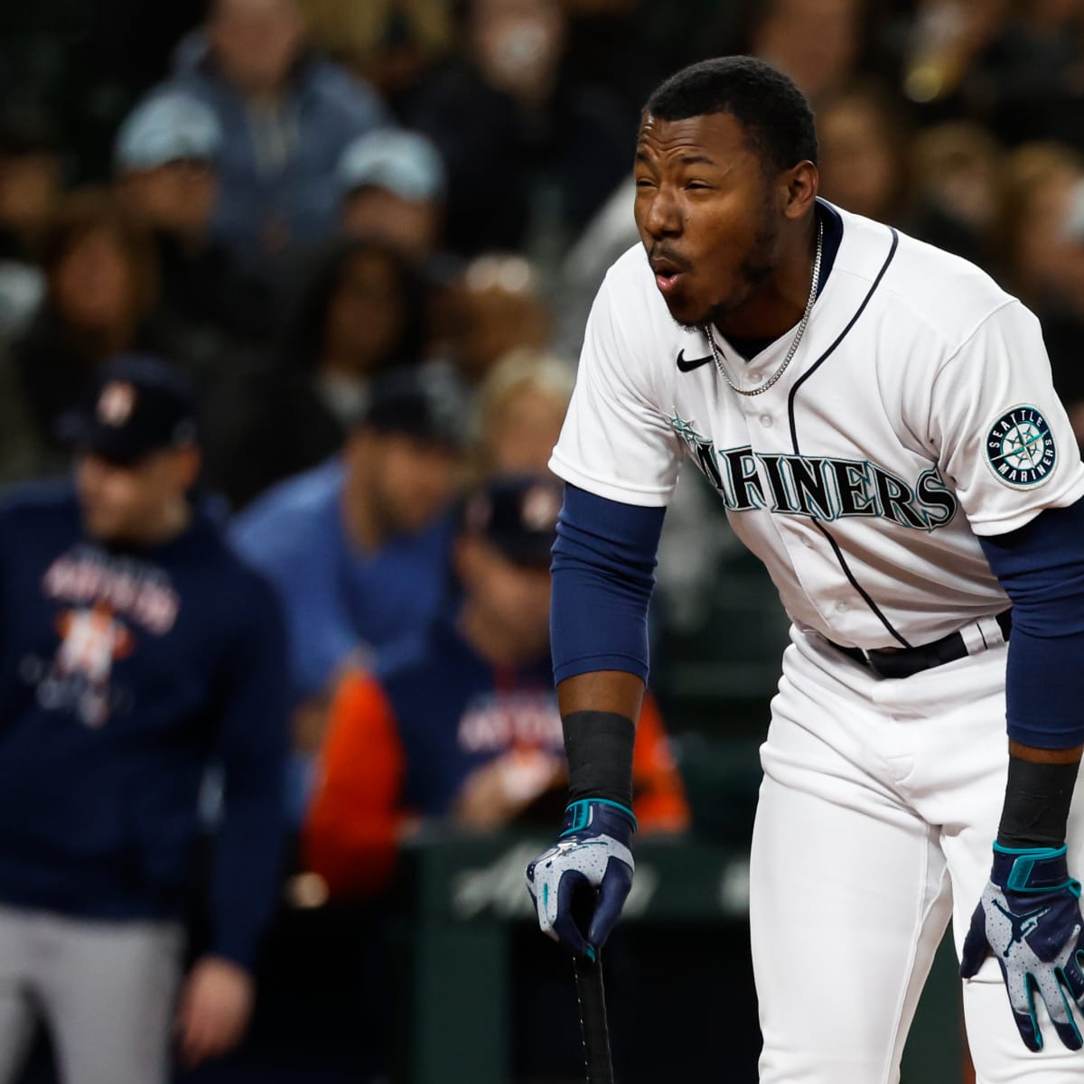 Seattle Mariners' Kyle Lewis (1) is greeted at the dugout by Taylor  Trammell, right, after Lewis hit a solo home run against the Houston Astros  during the second inning of a baseball