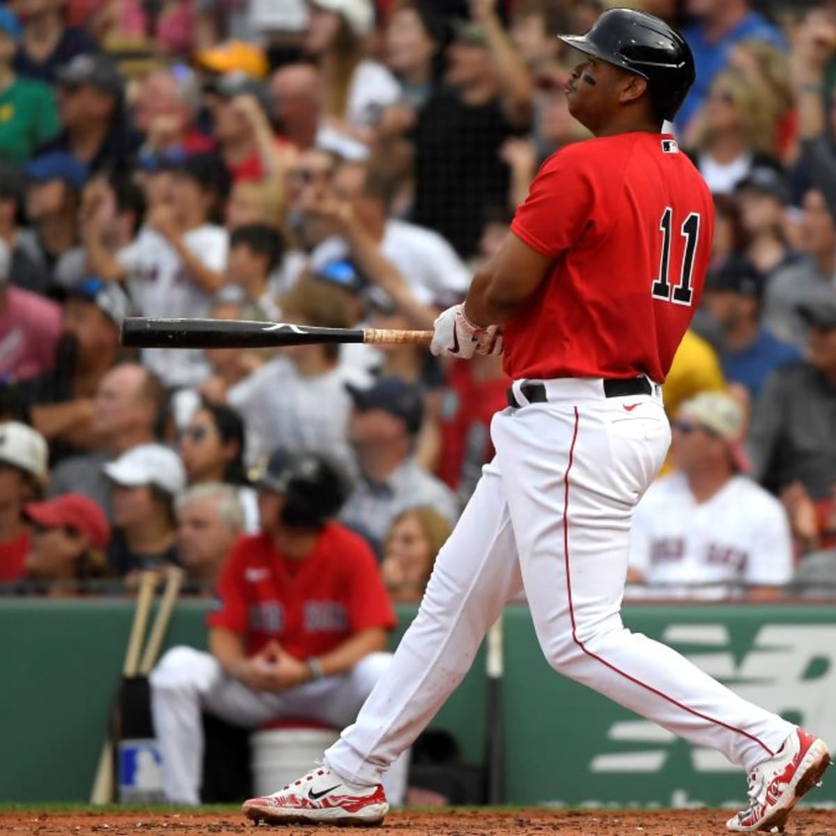 Boston Red Sox 3B Rafael Devers hangs his head after flying out