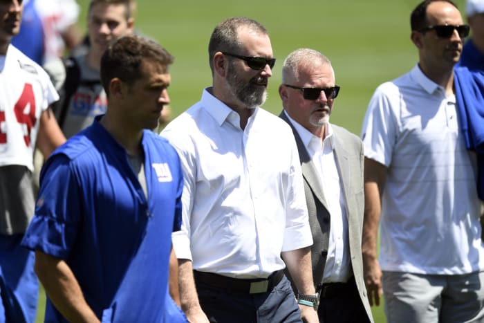 Jun 12, 2018; New York Giants interim general manager Kevin Abrams , second from left, walks off the field during minicamp.