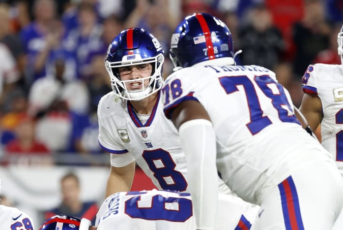 Nov 22, 2021; Tampa, Florida, USA; New York Giants quarterback Daniel Jones (8) calls aa play as offensive tackle Andrew Thomas (78) looks on against the Tampa Bay Buccaneers during the second quarter at Raymond James Stadium.