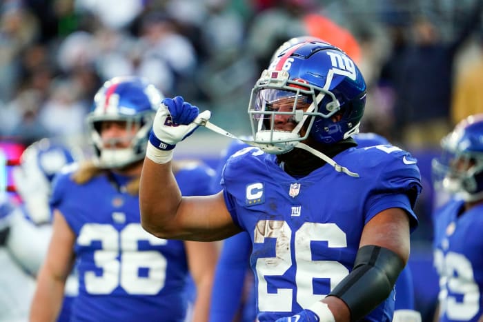 New York Giants running back Saquon Barkley (26) reacts as the offense leaves the field in the second half at MetLife Stadium. The Giants fall to the Cowboys, 21-6, on Sunday, Dec. 19, 2021, in East Rutherford.