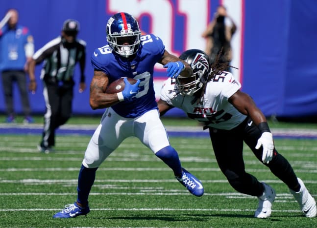 Sep 26, 2021; E. Rutherford, N.J., USA; New York Giants wide receiver Kenny Golladay (19) runs with the ball as Atlanta Falcons linebacker Steven Means (55) defends at MetLife Stadium.