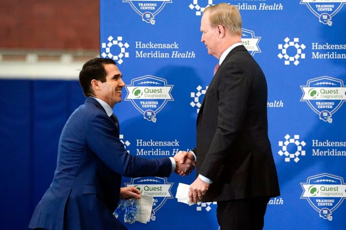 New York Giants General Manager Joe Schoen, left, shakes hands with CEO and co-owner John Mara during Schoen's introductory press conference at the Quest Diagnostics Training Center on Wednesday, Jan. 26, 2022.