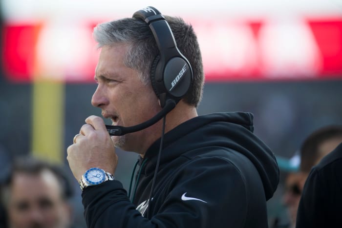 Eagles defensive coordinator Jim Schwartz speaks with the coaching staff Sunday at Lincoln Financial Field.