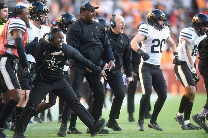 From left linebackers coach John Egorugwu, defensive ends coach Jovan Haye, and head coach Clark Lea celebrate as their defense stops Tennessee on a fourth down near the end zone in Neyland Stadium, Saturday, Nov. 27, 2021.