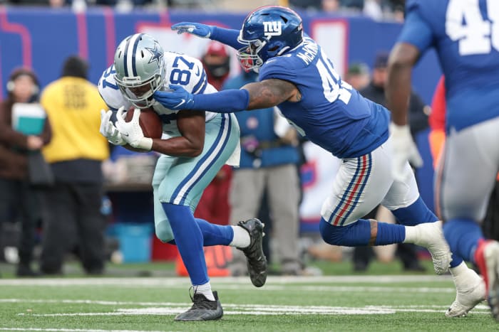 Dec 19, 2021; East Rutherford, New Jersey, USA; Dallas Cowboys tight end Jeremy Sprinkle (87) is tackled by New York Giants inside linebacker Benardrick McKinney (49) during the second half at MetLife Stadium.