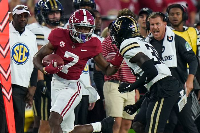 Alabama Crimson Tide wide receiver Ja'Corey Brooks (7) pushes away Vanderbilt Commodores defensive back Jeffrey Ugochukwu (38) during the first half at Bryant-Denny Stadium.
