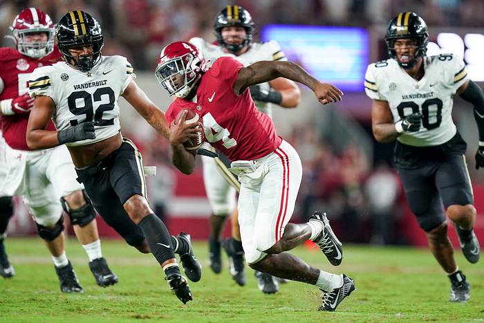 Alabama Crimson Tide quarterback Jalen Milroe (4) carries the ball against the Vanderbilt Commodores during the second half at Bryant-Denny Stadium.