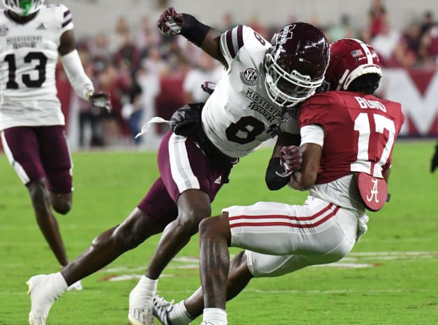 Mississippi State Bulldogs defensive back Jackie Matthews (8) hits Alabama Crimson Tide wide receiver Isaiah Bond (17) during the first half at Bryant-Denny Stadium. Matthews was ejected for targeting on the play.