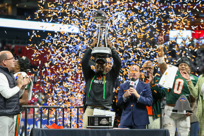 Dec 16, 2023; Atlanta, GA, USA; Florida A&amp;M Rattlers head coach Willie Simmons holds up the Celebration Bowl trophy after a victory against the Howard Bison at Mercedes-Benz Stadium.