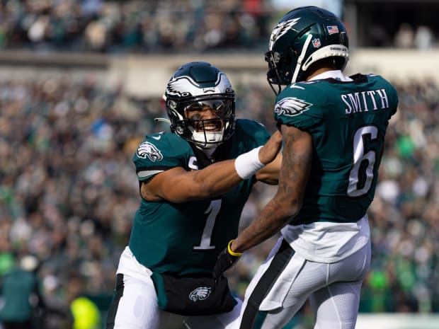 Dec 4, 2022; Philadelphia, Pennsylvania, USA; Philadelphia Eagles quarterback Jalen Hurts (1) and wide receiver DeVonta Smith (6) celebrate a touchdown connection against the Tennessee Titans during the first quarter at Lincoln Financial Field. Mandatory Credit: Bill Streicher-USA TODAY Sports