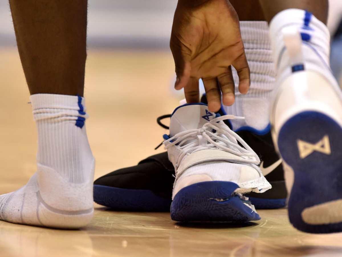 nike shoe ripped basketball