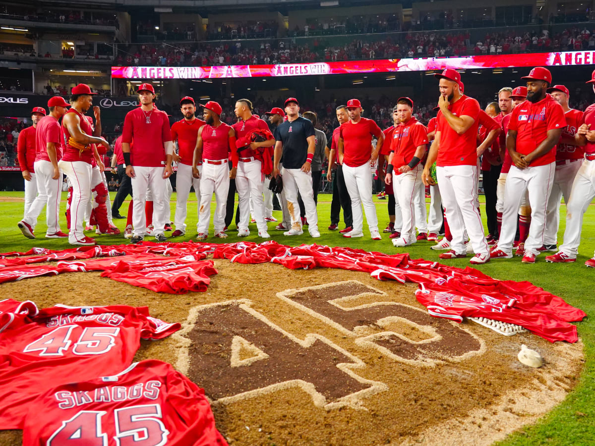 Los Angeles Angels bring Tyler Skaggs' jersey onto the field and