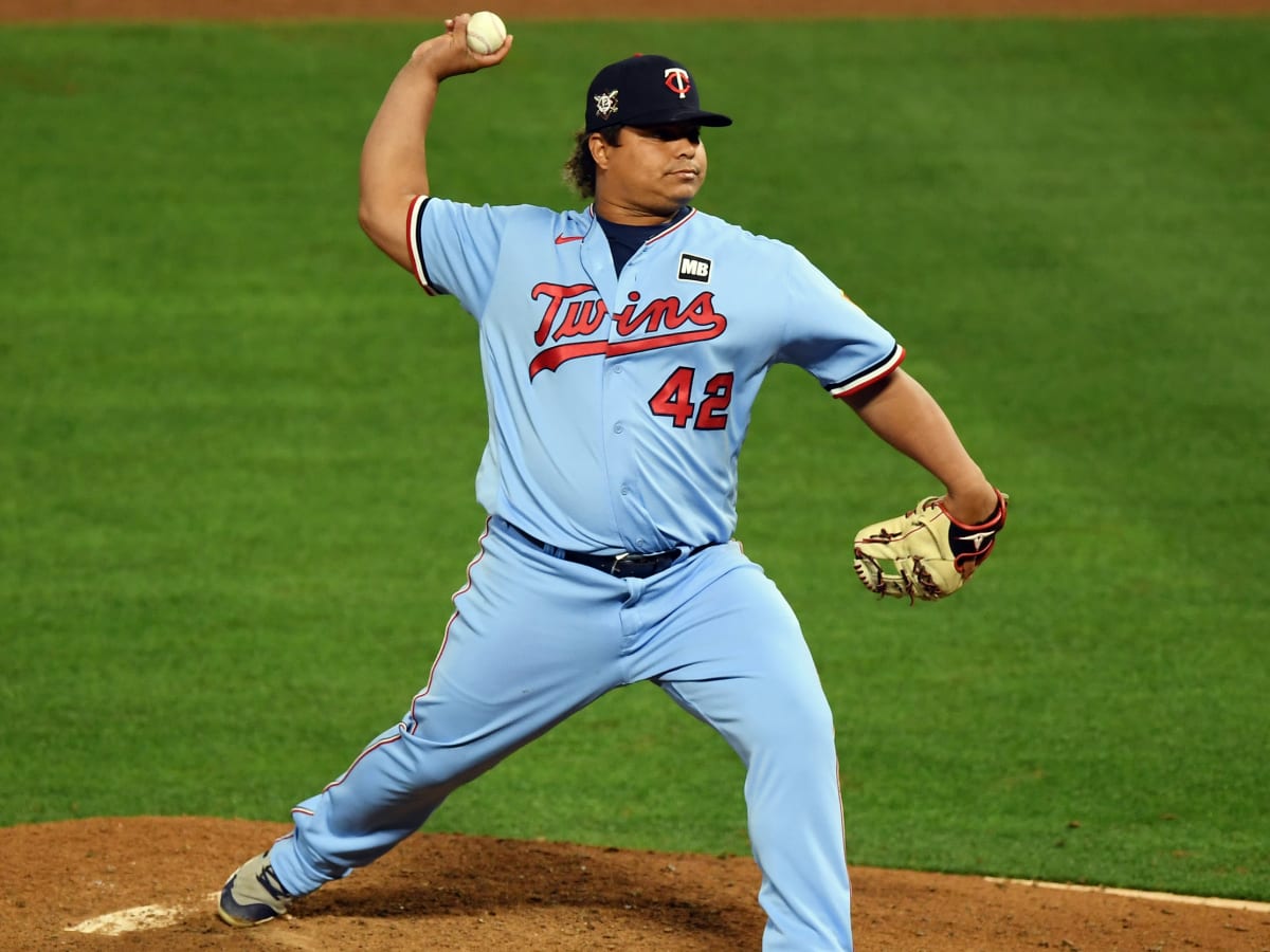 Minnesota Twins first baseman Willians Astudillo, left, is run