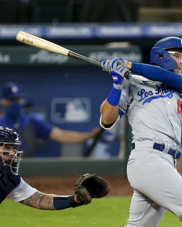 Aug 20, 2020; Seattle, Washington, USA; Los Angeles Dodgers designated hitter Matt Beaty (45) hits an RBI-double against the Seattle Mariners during the third inning at T-Mobile Park. Mandatory Credit: Joe Nicholson-USA TODAY Sports