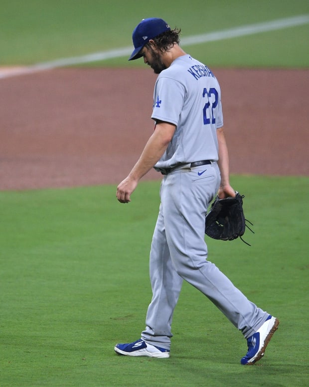 Sep 14, 2020; San Diego, California, USA; Los Angeles Dodgers starting pitcher Clayton Kershaw (22) walks to the dugout after being replaced during the seventh inning against the San Diego Padres at Petco Park. Mandatory Credit: Orlando Ramirez-USA TODAY Sports