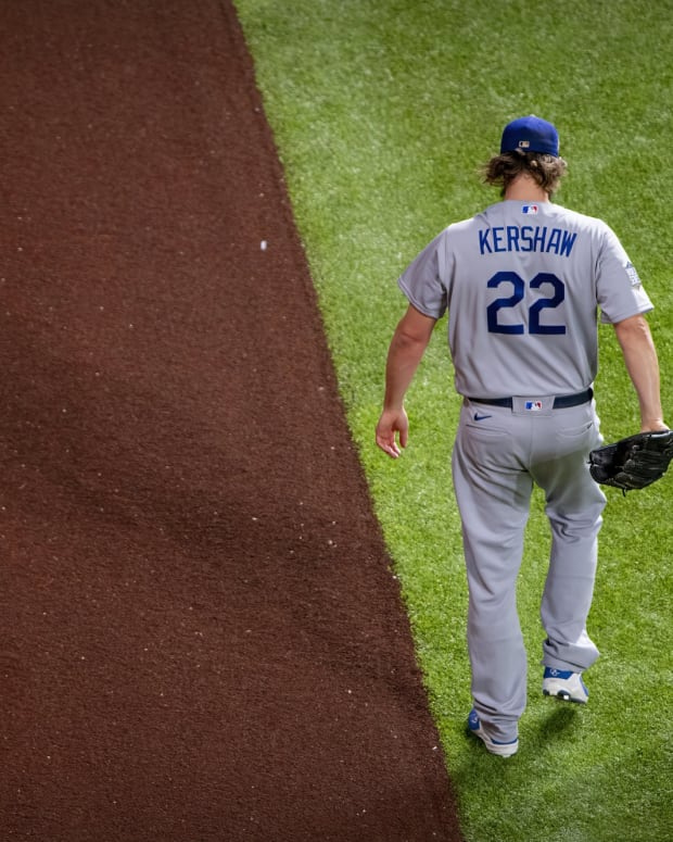Oct 25, 2020; Arlington, Texas, USA; Los Angeles Dodgers starting pitcher Clayton Kershaw (22) warms up before the game between the Tampa Bay Rays and the Los Angeles Dodgers in game five of the 2020 World Series at Globe Life Field. Mandatory Credit: Jerome Miron-USA TODAY Sports