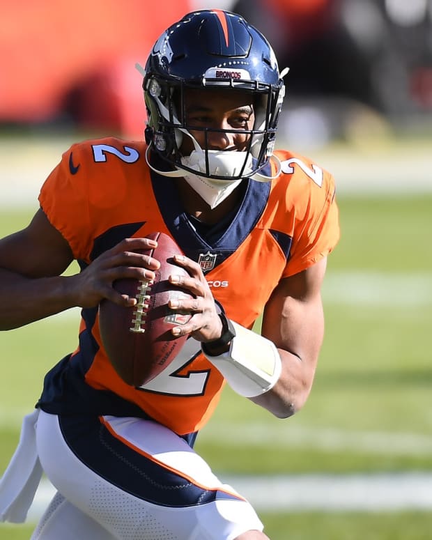 Denver Broncos quarterback Kendall Hinton (2) warms up before a game against the New Orleans Saints at Empower Field at Mile High.