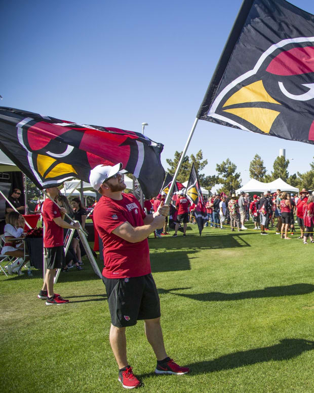 Arizona Cardinals fans arrive at the NFL Draft party on the Great Lawn outside State Farm Stadium, Thursday, April 25, 2019.