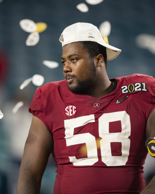 Jan 11, 2021; Miami Gardens, Florida, USA; Alabama Crimson Tide defensive lineman Christian Barmore (58) celebrates after defeating the Ohio State Buckeyes in the 2021 College Football Playoff National Championship Game.