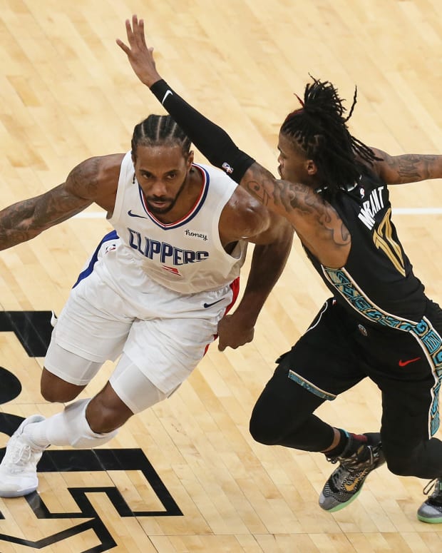 Feb 26, 2021; Memphis, Tennessee, USA; Los Angeles Clippers forward Kawhi Leonard (2) drives against Memphis Grizzlies guard Ja Morant (12) in the third quarter at FedExForum. Mandatory Credit: Nelson Chenault-USA TODAY Sports
