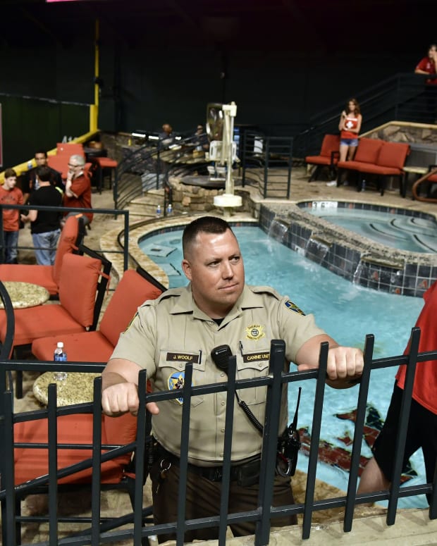 Oct 9, 2017; Phoenix, AZ, USA; Police and venue security guard the pool area following the Los Angeles Dodgers victory against the Arizona Diamondbacks in game three of the 2017 NLDS playoff baseball series at Chase Field. Mandatory Credit: Matt Kartozian-USA TODAY Sports