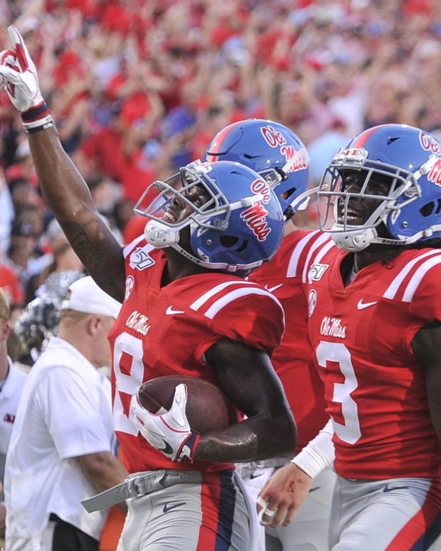 Mississippi Rebels wide receiver Elijah Moore (8) celebrates after scoring a touchdown during the first half against the Arkansas Razorbacks at Vaught-Hemingway Stadium. Mandatory Credit: Justin Ford-USA TODAY Sports