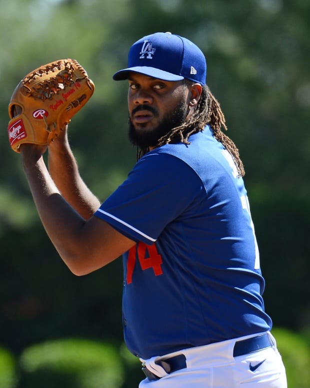 Feb 26, 2020; Phoenix, Arizona, USA; Los Angeles Dodgers relief pitcher Kenley Jansen (74) pitches against the Los Angeles Angels during the second inning of a spring training game at Camelback Ranch. Mandatory Credit: Joe Camporeale-USA TODAY Sports