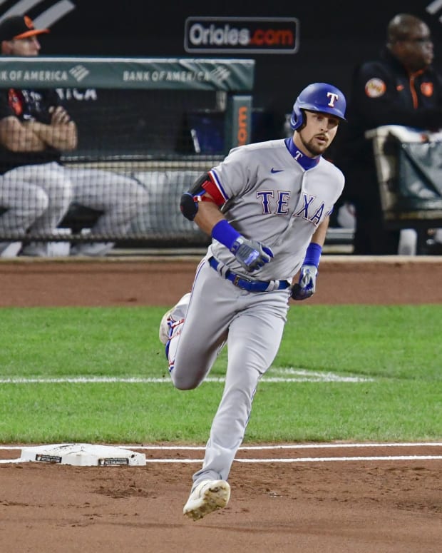 Sep 24, 2021; Baltimore, Maryland, USA; Texas Rangers first baseman Nathaniel Lowe (30) runs out a \1i] home run against the Baltimore Orioles at Oriole Park at Camden Yards.