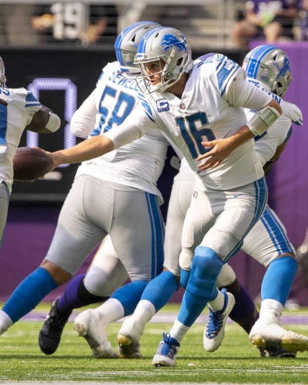 Oct 10, 2021; Minneapolis, Minnesota, USA; Detroit Lions running back Jamaal Williams (30) and quarterback Jared Goff (16) in action during the game between the Detroit Lions and the Minnesota Vikings at U.S. Bank Stadium. Mandatory Credit: Jerome Miron-USA TODAY Sports