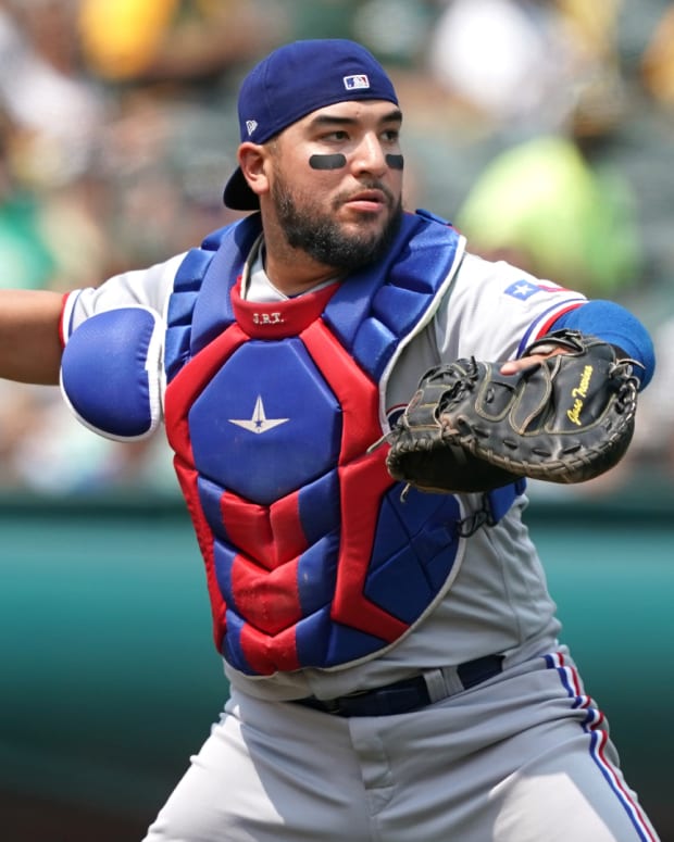 Aug 7, 2021; Oakland, California, USA; Texas Rangers catcher Jose Trevino (23) throws the ball to first base during the second inning against the Oakland Athletics at RingCentral Coliseum. Mandatory Credit: Darren Yamashita-USA TODAY Sports