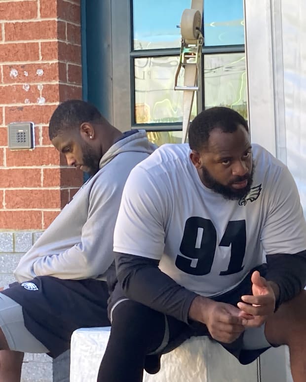 Eagles defensive takles Javon Hargrave (left( and Fletcher Cox wait their turns to speak to reporters on Wednesday, Oct. 20, 2021