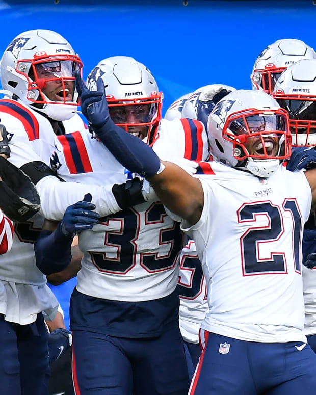 New England Patriots safety Adrian Phillips (21) celebrates after intercepting a pass and running it back for a touchdown during the second half of an NFL football game against the Los Angeles Chargers Sunday, Oct. 31, 2021, in Inglewood, CA