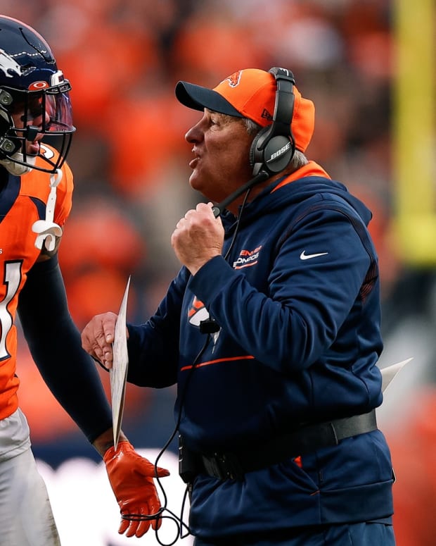 Denver Broncos head coach Vic Fangio talks with safety Justin Simmons (31) in the fourth quarter against the Washington Football Team at Empower Field at Mile High.