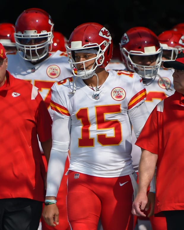 Oct 24, 2021; Nashville, Tennessee, USA; Kansas City Chiefs quarterback Patrick Mahomes (15) stands with Kansas City Chiefs head coach Andy Reid just prior to taking the field against the Tennessee Titans at Nissan Stadium. Mandatory Credit: Steve Roberts-USA TODAY Sports