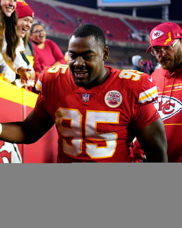 Nov 1, 2021; Kansas City, Missouri, USA; Kansas City Chiefs defensive end Chris Jones (95) celebrates with fans in the stands after defeating the New York Giants at GEHA Field at Arrowhead Stadium. Mandatory Credit: Jay Biggerstaff-USA TODAY Sports
