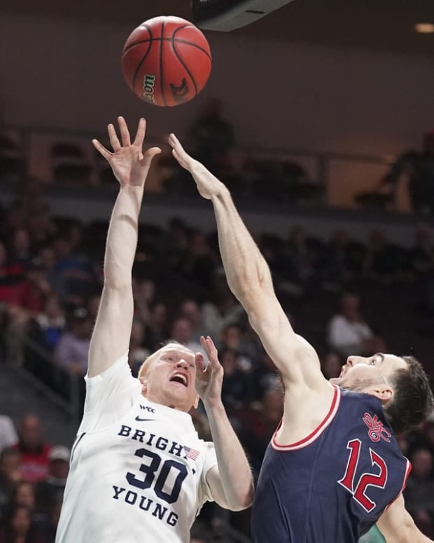March 9, 2020; Las Vegas, NV, USA; BYU Cougars guard TJ Haws (30) shoots the basketball against Saint Mary's Gaels guard Tommy Kuhse (12) during the second half during the semifinal game in the WCC Basketball Championships at Orleans Arena. Mandatory Credit: Kyle Terada-USA TODAY Sports
