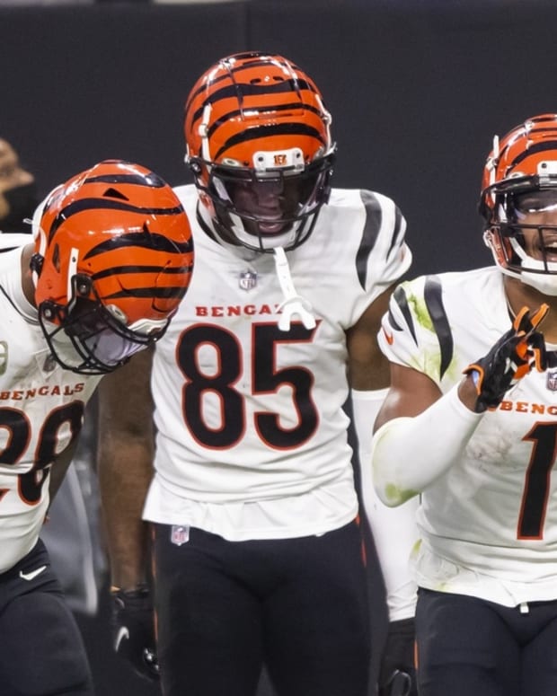 Nov 21, 2021; Paradise, Nevada, USA; Cincinnati Bengals wide receiver Ja'Marr Chase (1) celebrates with running back Joe Mixon (28) and wide receiver Tee Higgins (85) after scoring a touchdown against the Las Vegas Raiders in the second half at Allegiant Stadium. Mandatory Credit: Mark J. Rebilas-USA TODAY Sports