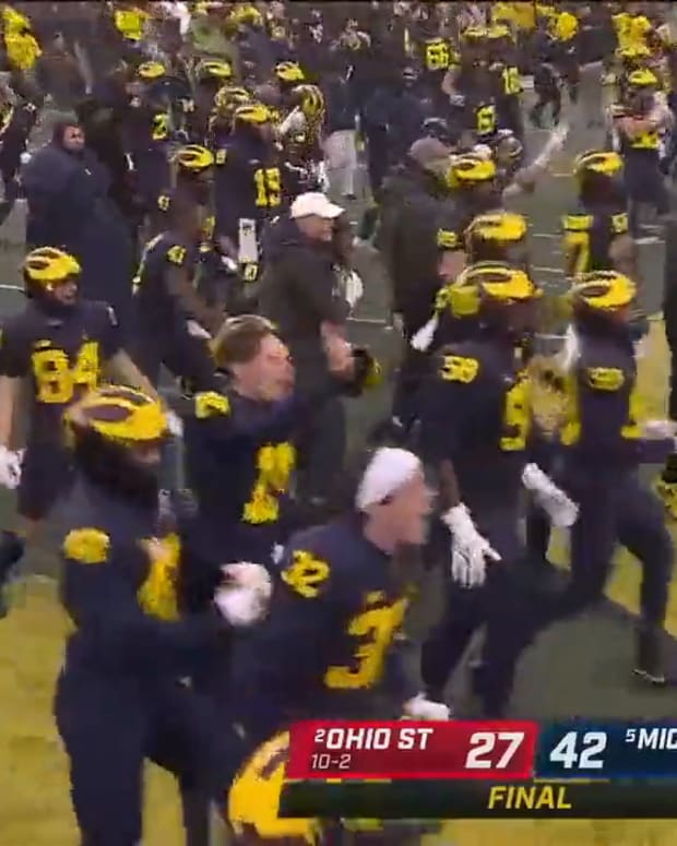 Michigan Fans Storm Field After Victory Over Ohio State