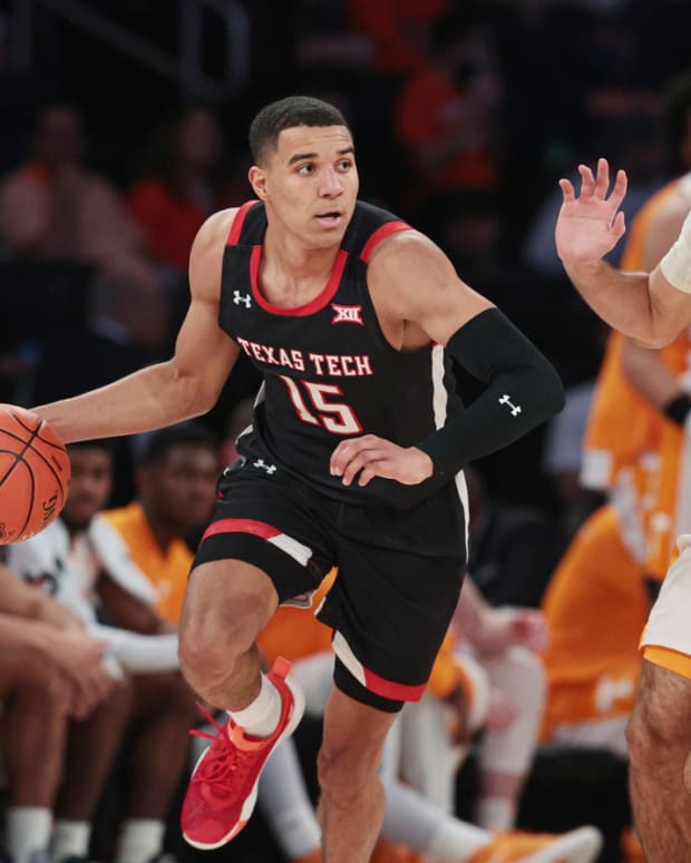 Dec 7, 2021; New York, New York, USA; Texas Tech Red Raiders guard Kevin McCullar (15) dribbles up court in front of Tennessee Volunteers guard Santiago Vescovi (25) during the second half at Madison Square Garden. Mandatory Credit: Vincent Carchietta-USA TODAY Sports