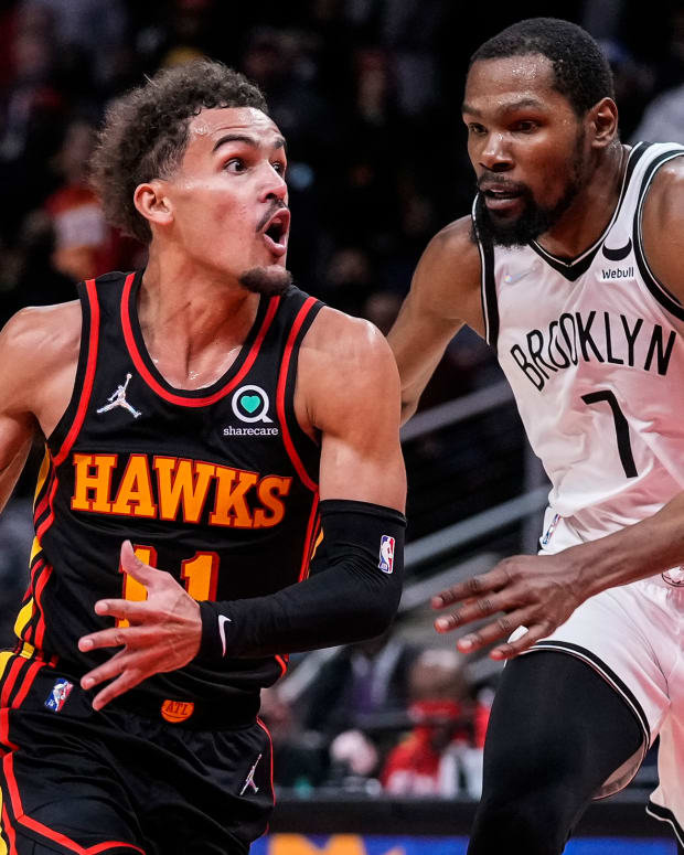 Atlanta Hawks guard Trae Young (11) tries to get to the basket guarded by Brooklyn Nets forward Kevin Durant (7) during the second half at State Farm Arena.
